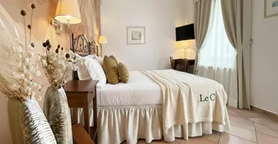 a hotel room with a bed and a window at Le Clarisse Trastevere in Rome
