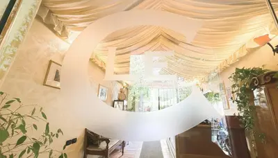 a large white sign on the ceiling of a room at Le Clarisse Trastevere in Rome