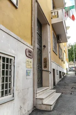 an entrance to a building with stairs to a door at Albergo Athena in Rome