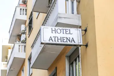a hotel athtar sign on the side of a building at Albergo Athena in Rome