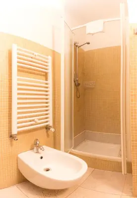 a bathroom with a sink and a shower at Residenza Ki in Rome