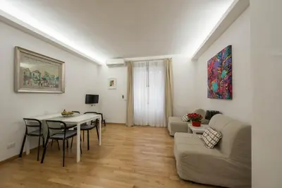 a living room with a table and a couch at Saint Peter Apartment in Rome
