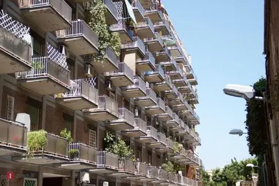 an apartment building with balconies and plants on it at Saint Peter Apartment in Rome