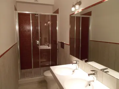 a bathroom with a sink and a shower and a toilet at Houspitality Nero Bed & Breakfast in Rome