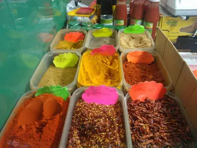 a display of different colored spices in containers at Houspitality Nero Bed & Breakfast in Rome