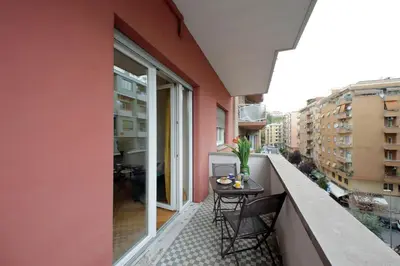 a balcony with a table and chairs on it at 4BNB - Cipro Vatican Apartment in Rome