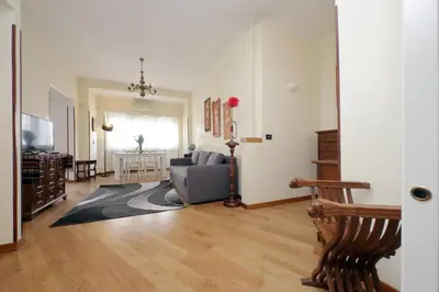 a living room with a couch and a table at 4BNB - Cipro Vatican Apartment in Rome