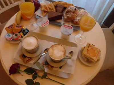 a white table with breakfast foods and drinks on it at Dante's in Vaticano in Rome