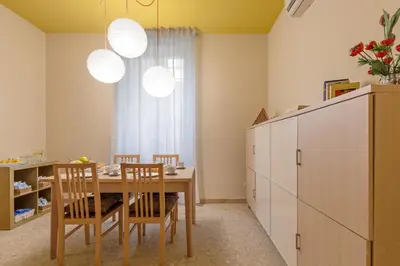 a kitchen with a dining room table and chairs at B&B L'Amaca in Rome