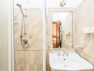 a bedroom with a large bed with towels on it at Il Gattopardo Relais in Rome