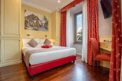a hotel room with a bed and a window at Al Viminale Hill Inn & Hotel in Rome
