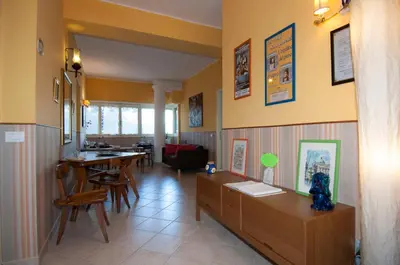a living room with a table and a dining room at Passeggiate Romane in Rome