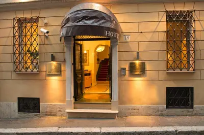 a entrance to a store with a black awning at Hotel Gregoriana in Rome