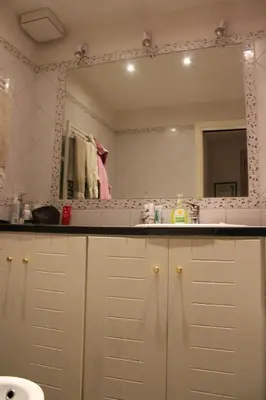 a bathroom with a sink and a mirror at B&B&Courtesy in Rome