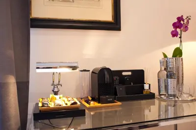 a counter top with a coffee maker and food on it at Town House 62 in Rome