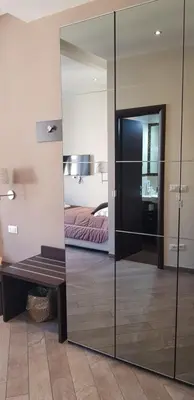 a room with a glass partition with a bed at Mia Suites in Rome