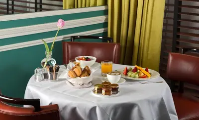 a table with plates of food and fruit on it at J.K. Place Roma - The Leading Hotels of the World in Rome