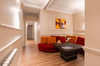 a living room with a couch and a table at Hotel Magic in Rome