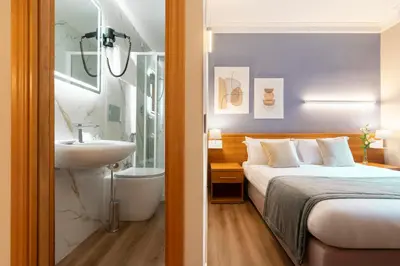 a hotel room with a bed and a sink at Hotel Magic in Rome