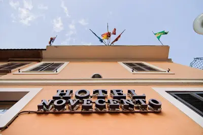 a building with a sign on top of it at Hotel Novecento in Rome