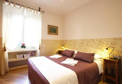 a bedroom with a bed with two towels on it at Campanella3 in Rome