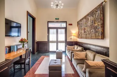 a living room with a couch and a table at Hotel Diocleziano in Rome