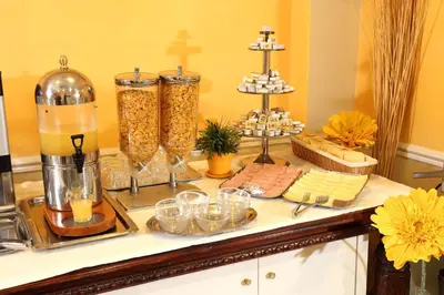 a buffet of food and drinks on a counter at Hotel Nizza in Rome
