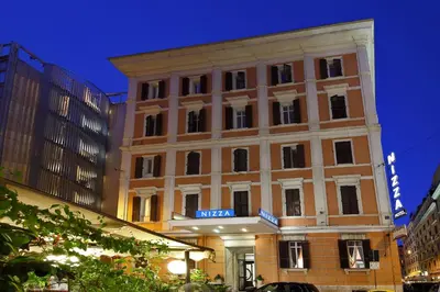 a building with a sign on the front of it at Hotel Nizza in Rome