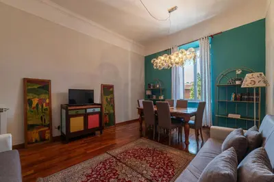 a living room with a couch and a table at HospitalityRome Domus Colosseo in Rome