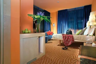 a room with a bed and a couch in a room at Hotel Abitart in Rome