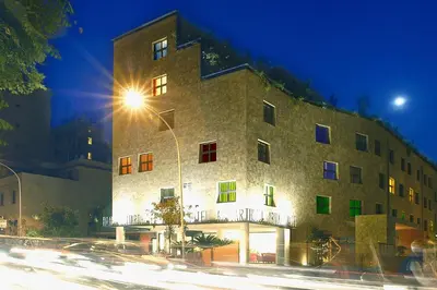 a building with a street light in front of it at Hotel Abitart in Rome