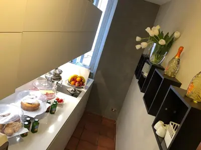 a kitchen with a table with food on it at 207 Inn in Rome