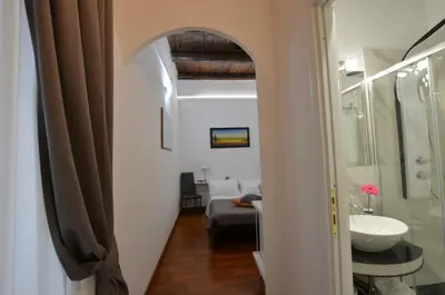 a bathroom with a sink and a toilet in a room at Notti A Roma in Rome
