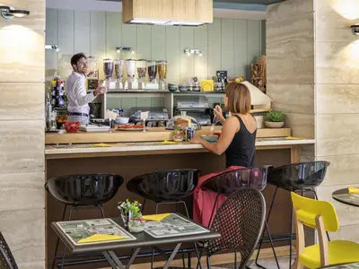 a bakery with a bunch of food on a counter at Aparthotel Adagio Rome Vatican in Rome
