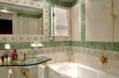 a bathroom with a sink and a tub and a mirror at Hotel Homs in Rome