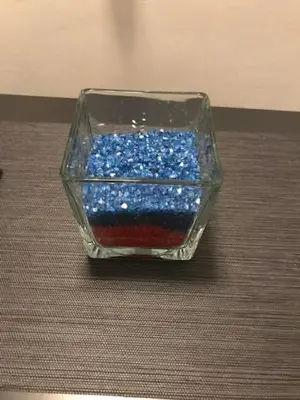 a glass container filled with blue and red glitter at Ai Senatori in Rome