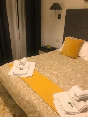 a hotel room with a bed with towels on it at Ai Senatori in Rome