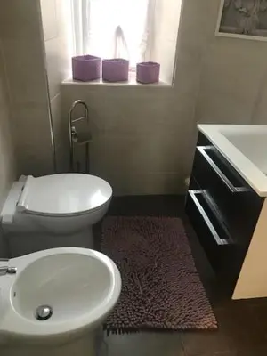 a bathroom with a white toilet and a sink at Ai Senatori in Rome