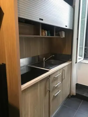 a kitchen with a sink and a counter top at Ai Senatori in Rome