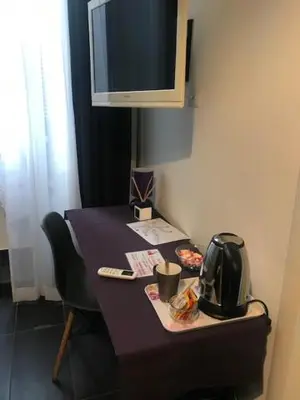 a table with a tv on top of it at Ai Senatori in Rome