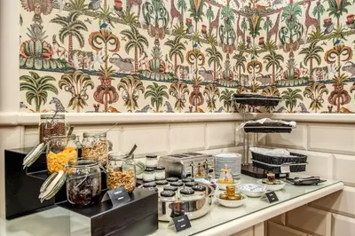 a counter with a bunch of food on it at The Britannia Hotel in Rome