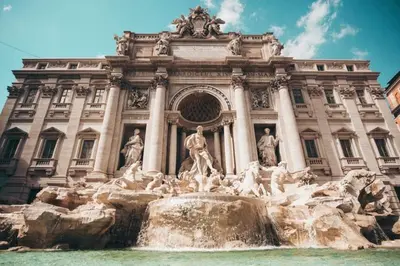 a building with a fountain in front of it at Hotel Lodi in Rome