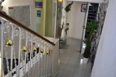 a hallway with a staircase with christmas ornaments at Hotel Lodi in Rome
