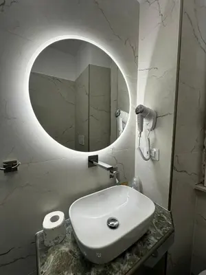 a bathroom with a white sink and a mirror at Hotel Lodi in Rome