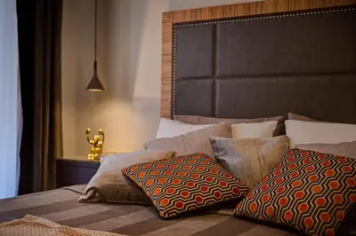 a bedroom with a bed with pillows on it at Intown Luxury House in Rome