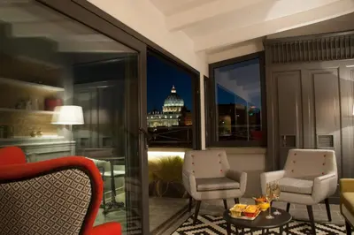 a living room with a view of the capitol building at Trianon Borgo Pio Aparthotel in Rome