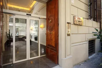 an entrance to a building with a wooden door at Trianon Borgo Pio Aparthotel in Rome