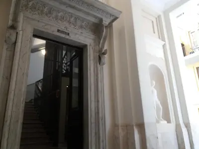 an ornate doorway to a building with a staircase at Residence Europa in Rome