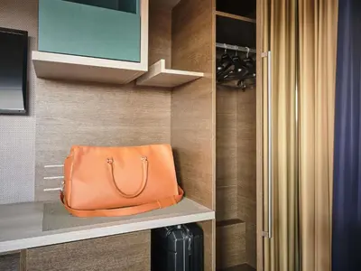 a hotel room with a bed and a window at Mercure Roma Centro Colosseo in Rome