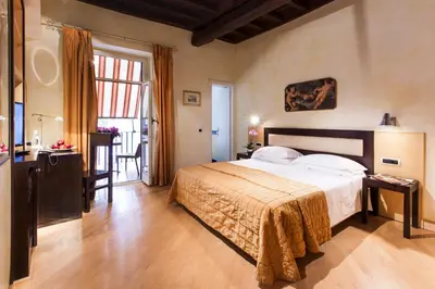 a bedroom with a large bed in a room at Hotel De Petris in Rome